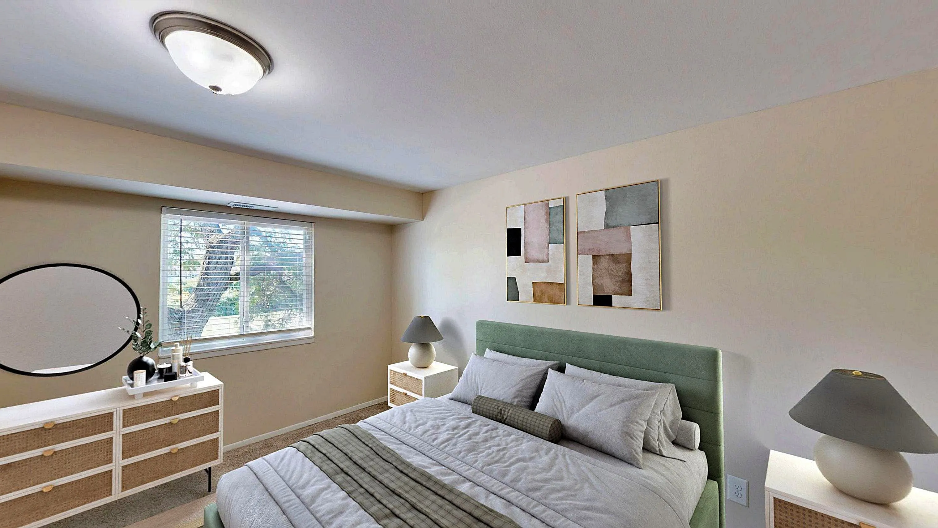 Tranquil bedroom with modern decor, featuring a plush green headboard, chic abstract art, and ample natural lighting.