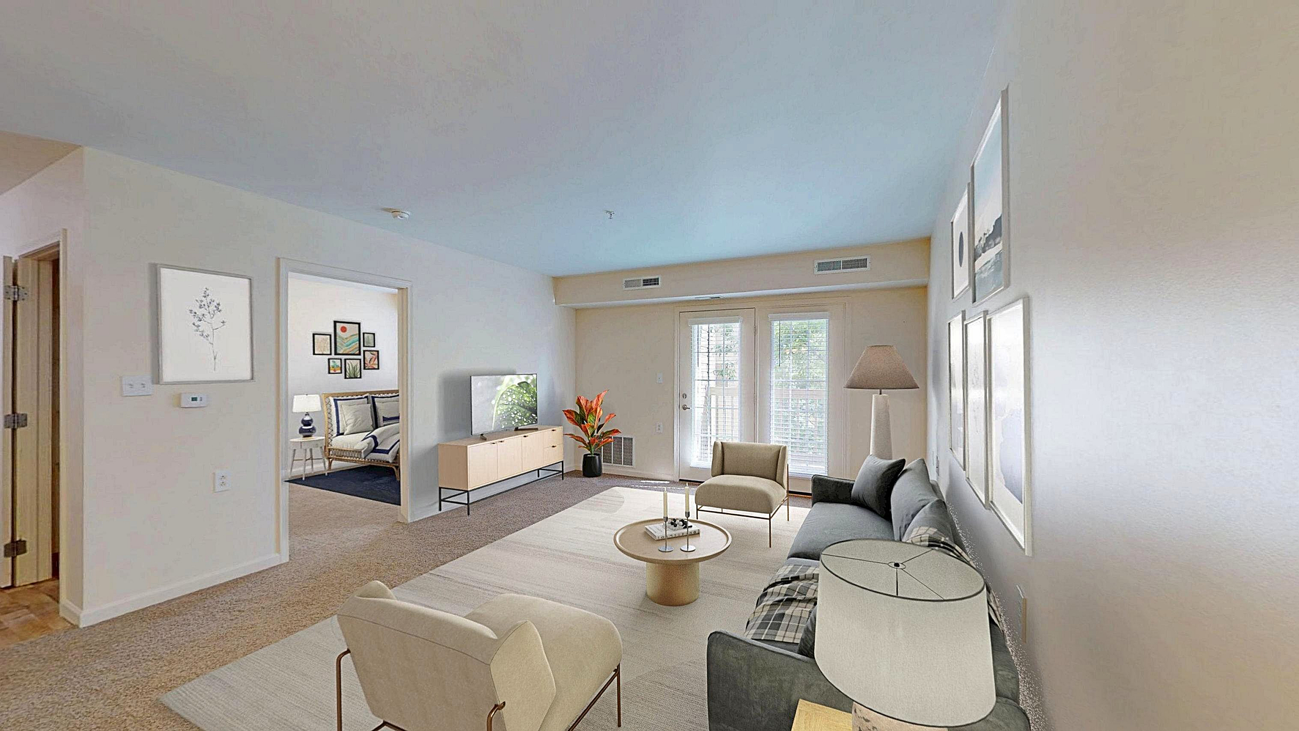 Bright and airy living room featuring modern decor, cozy seating, large windows, and soft neutral tones creating a welcoming atmosphere.