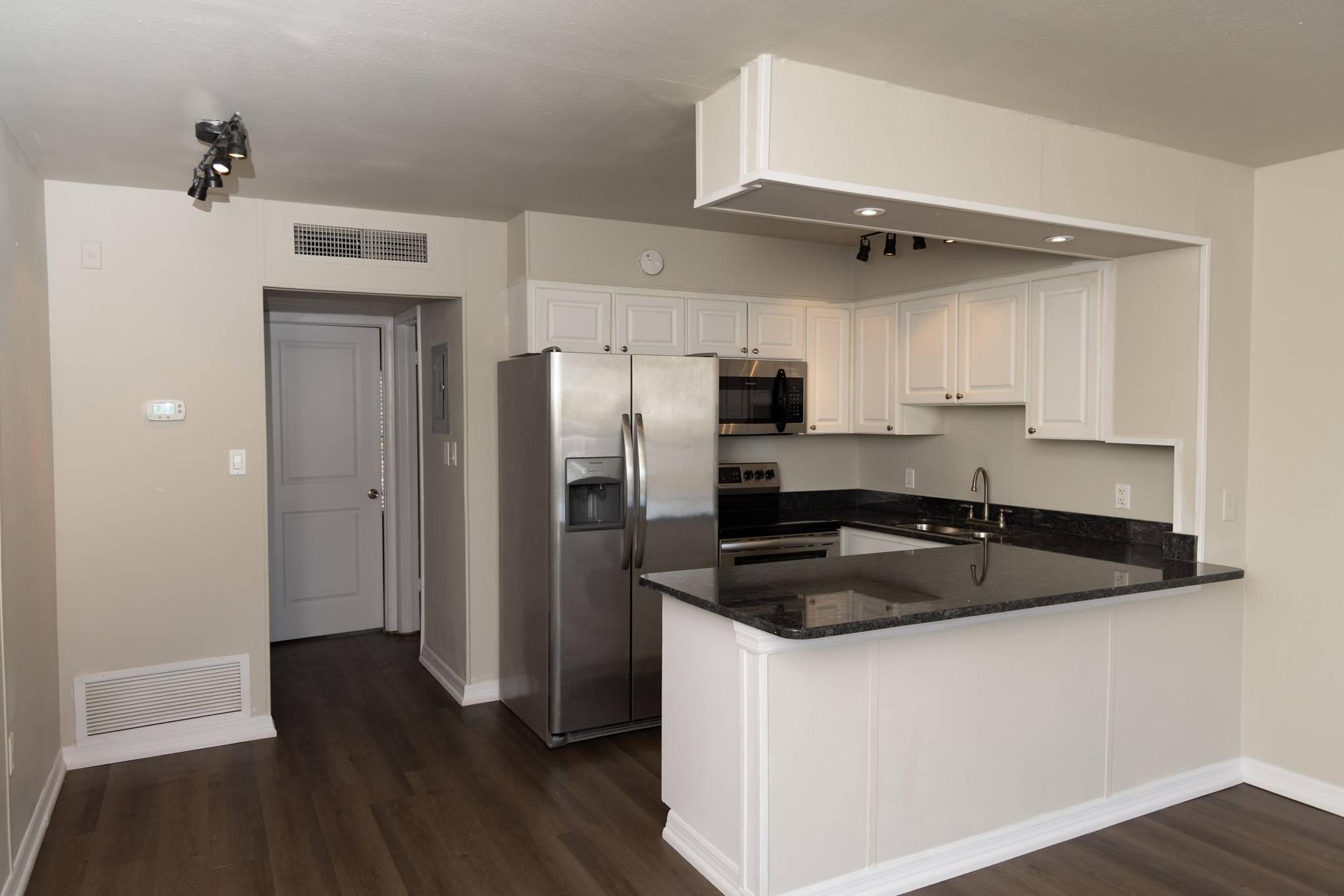 kitchen, counter tops, sink, stain steel appliances, white cabinets