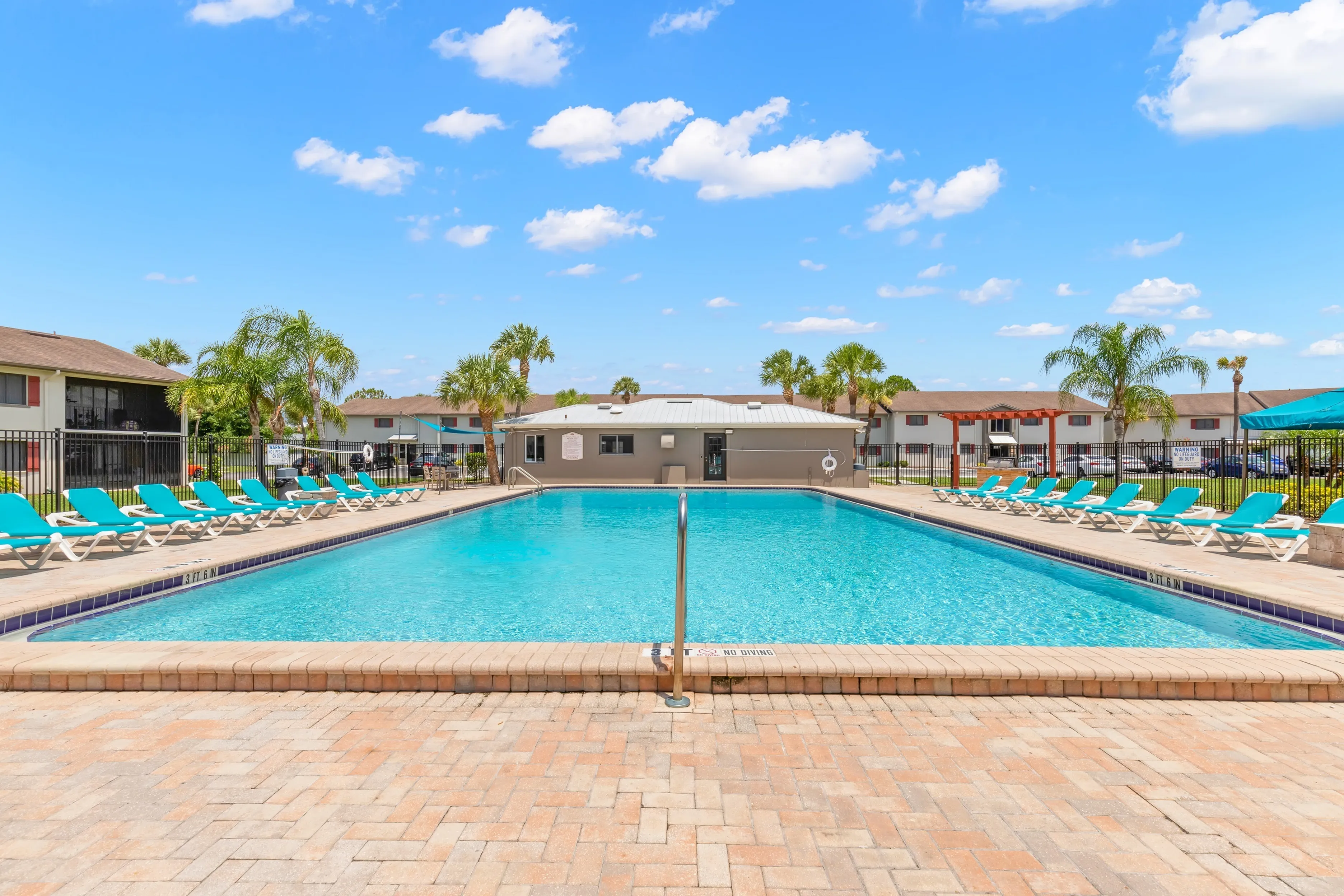 Sparkling Swimming Pool with Chaise Lounges