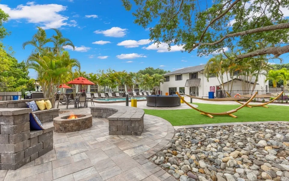 Fire pit, hammocks, lounge area, tables, chairs, swimming pool, lounge chairs