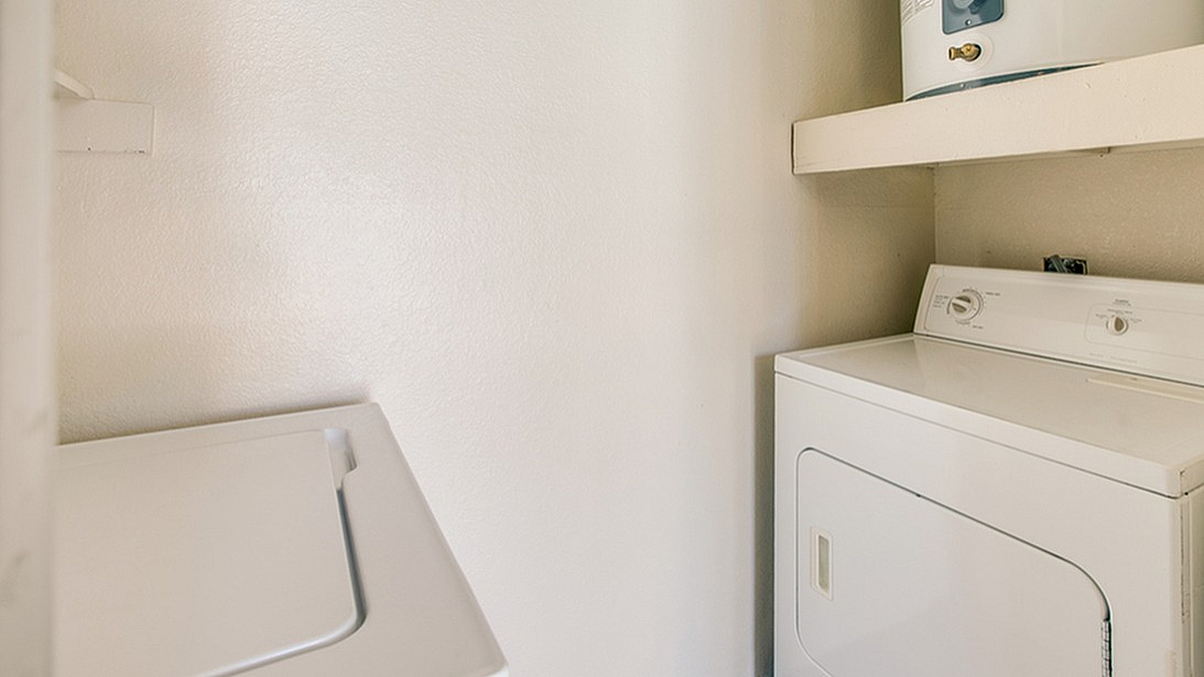 Compact laundry space featuring a modern washer and dryer, perfect for convenient apartment living.