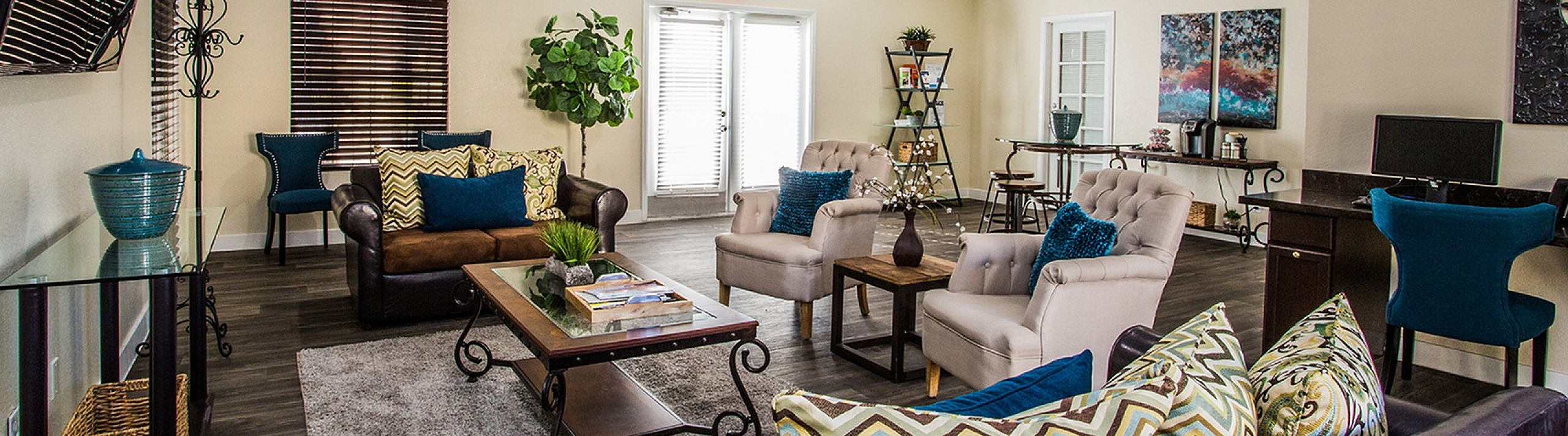 Spacious and stylish lounge with modern decor, cozy seating, and natural lighting.