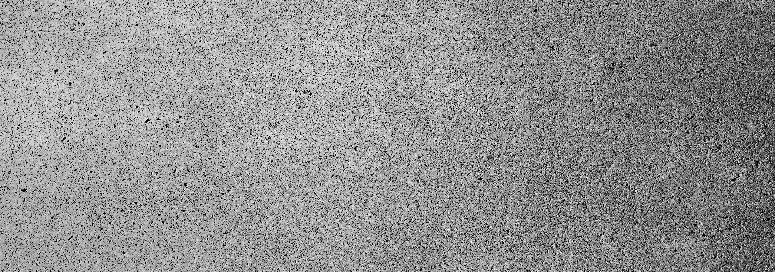 Modern textured concrete wall with a stylish grey finish, suitable for contemporary interiors.