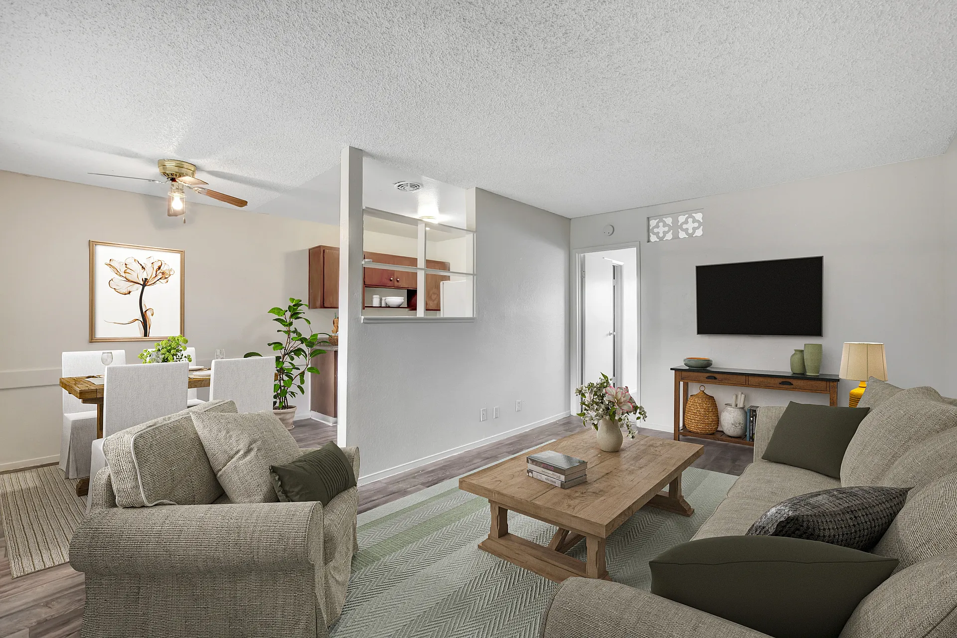 Inviting living space with a cozy seating area, stylish coffee table, elegant dining setup, and modern decor.
