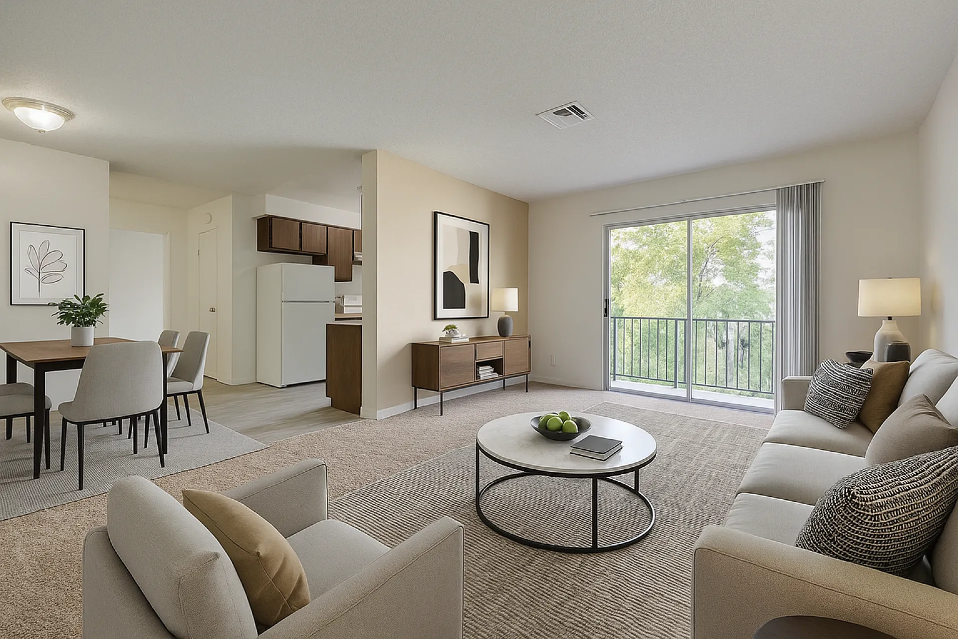 Modern living space with elegant decor, featuring a cozy seating area and large sliding glass doors leading to a scenic balcony view.