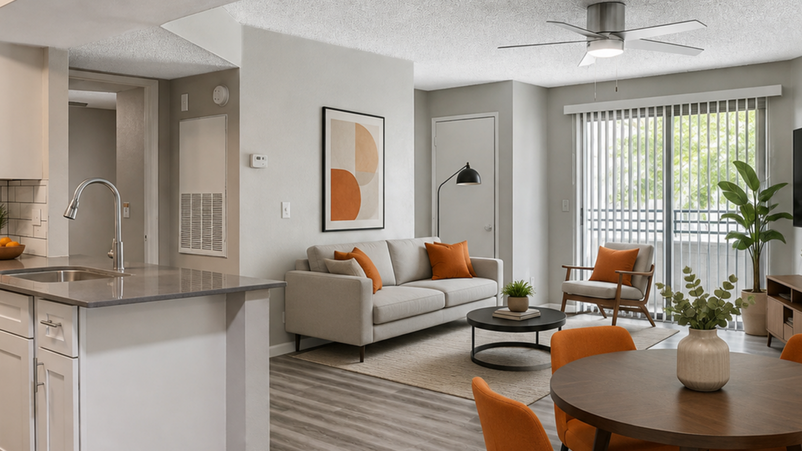 Modern open-concept living area with sleek kitchen, cozy seating, and vibrant decor. Floor-to-ceiling windows illuminate the stylish space, perfect for relaxation and entertainment.