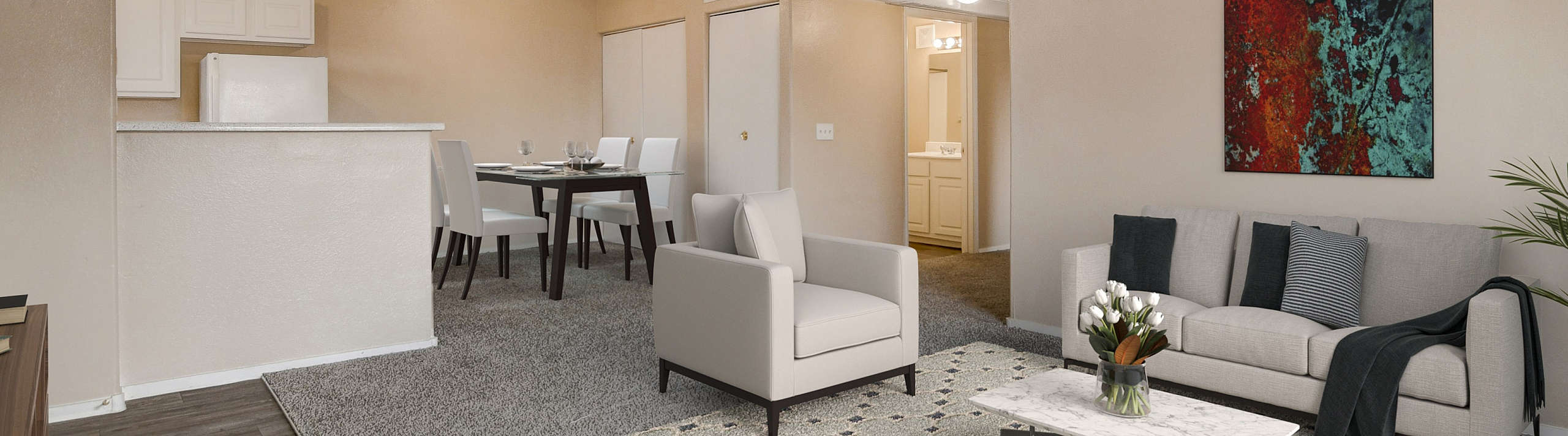 Elegant open-concept living space featuring a modern sectional sofa, chic dining area, stylish d&eacute;cor, and a cozy kitchen nook.