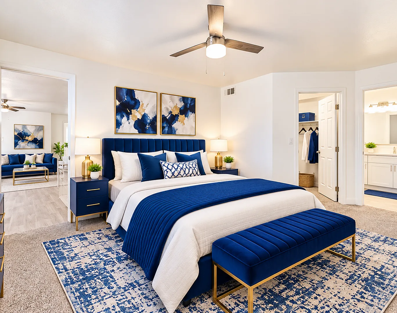 Luxurious bedroom with modern blue and white decor, featuring a plush bed, stylish artwork, and a walk-in closet, exuding elegance and comfort.