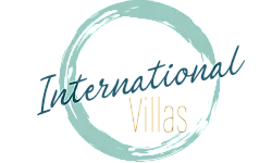 Elegant logo for International Villas featuring a stylized circular brushstroke design.