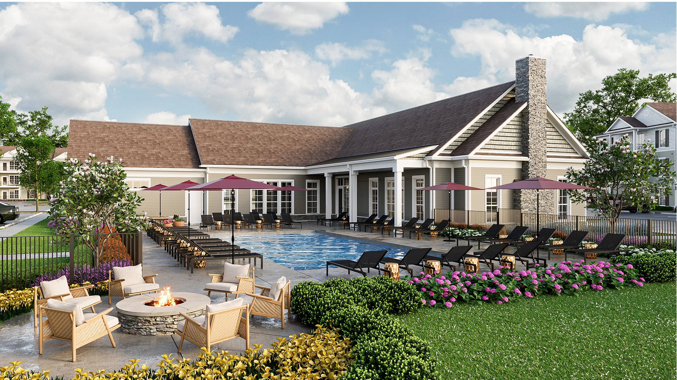 Luxurious outdoor space with a sparkling pool, chic loungers, and vibrant landscaped gardens, perfect for relaxation and entertaining.