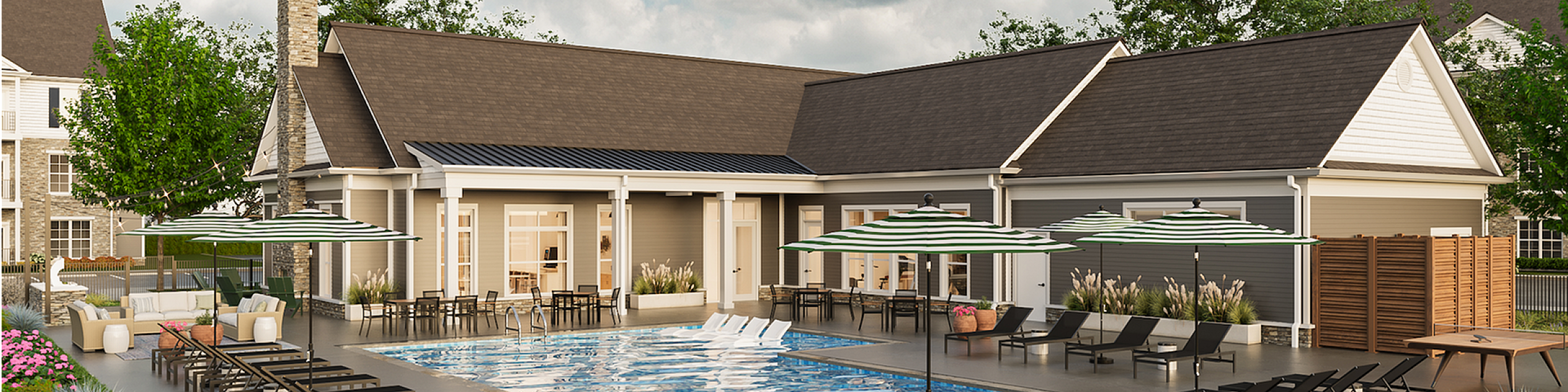 Luxurious outdoor pool area with stylish loungers, vibrant landscaping, and elegant clubhouse, perfect for relaxation and social gatherings.