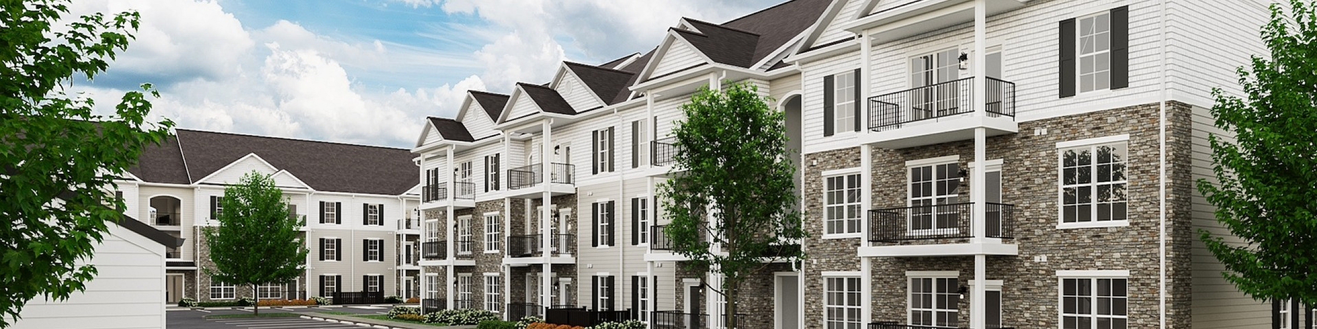 Elegant apartment complex with modern architecture, spacious balconies, and lush landscaping set under a vibrant blue sky.