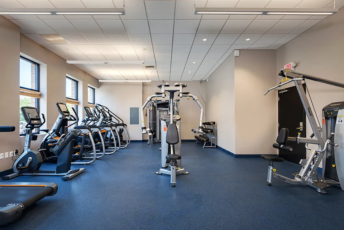 The fitness center at our apartments in Storrs, CT, featuring treadmills and other exercise machines.