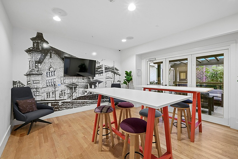 lounge with bar seating and tv
