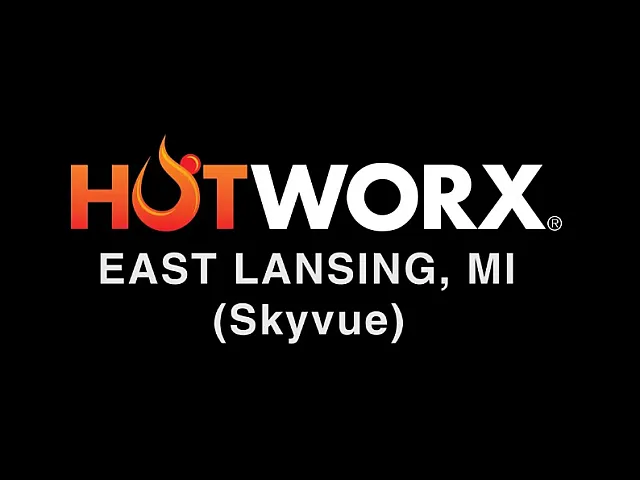 Dynamic logo for HOTWORX East Lansing, MI (Skyvue) featuring bold lettering with a fiery accent, set against a sleek black background.