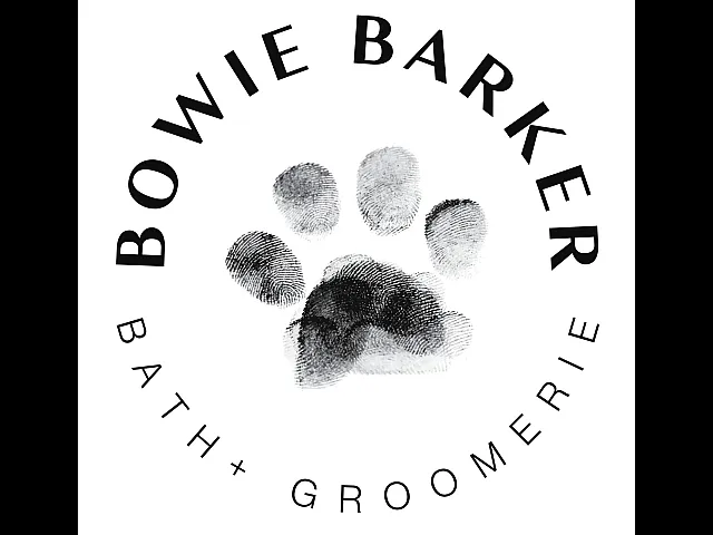 Elegant logo for a bath and grooming service featuring a paw print design.