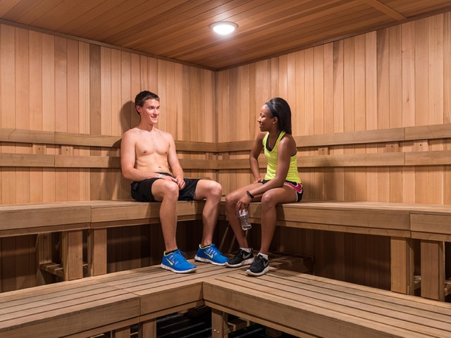 two residents relaxing in the community sauna