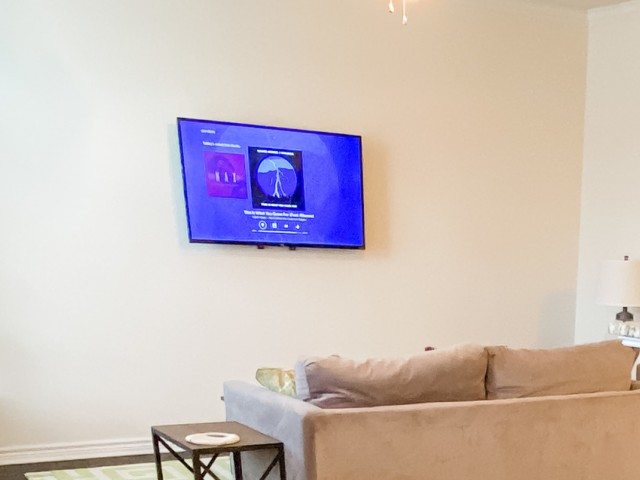 Wall Mounted 50” Smart TV in Living Room