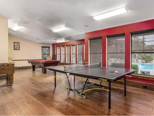 game room with ping-pong, foosball, and pool tables