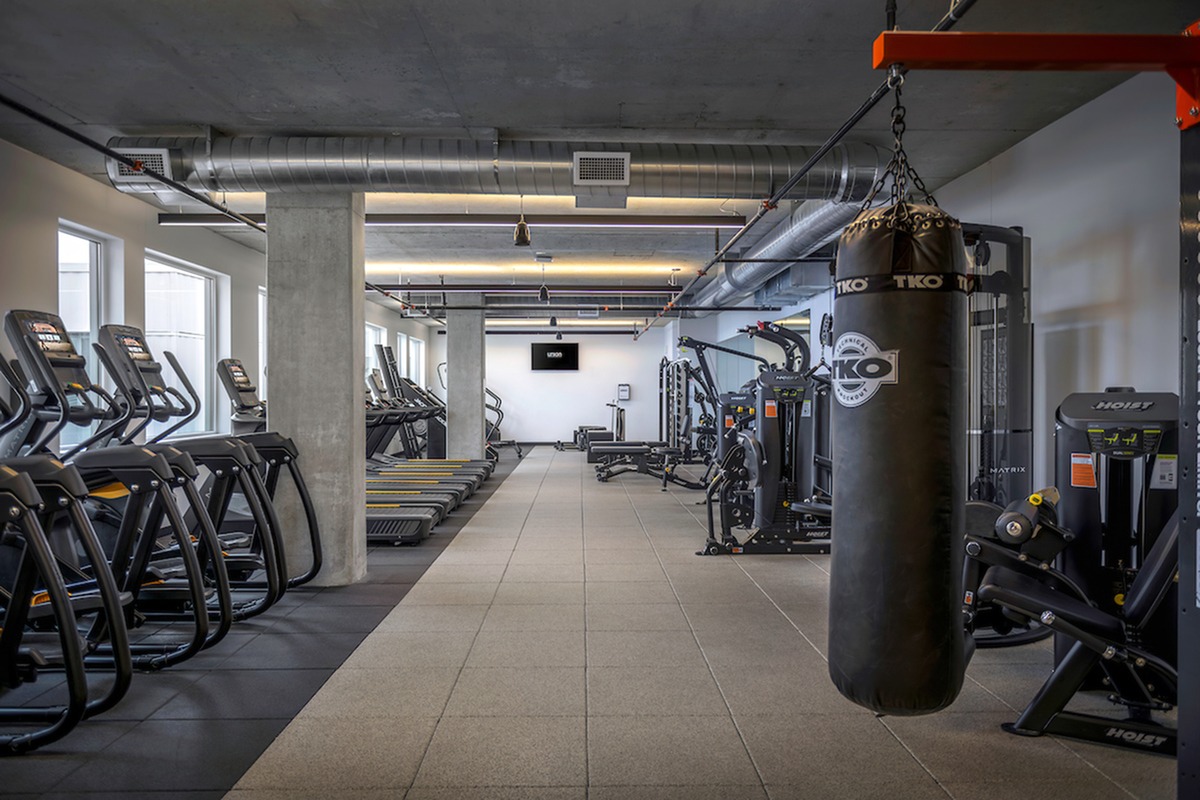 Fitness Center with punching bag, cardio equipment, and various exercise machines