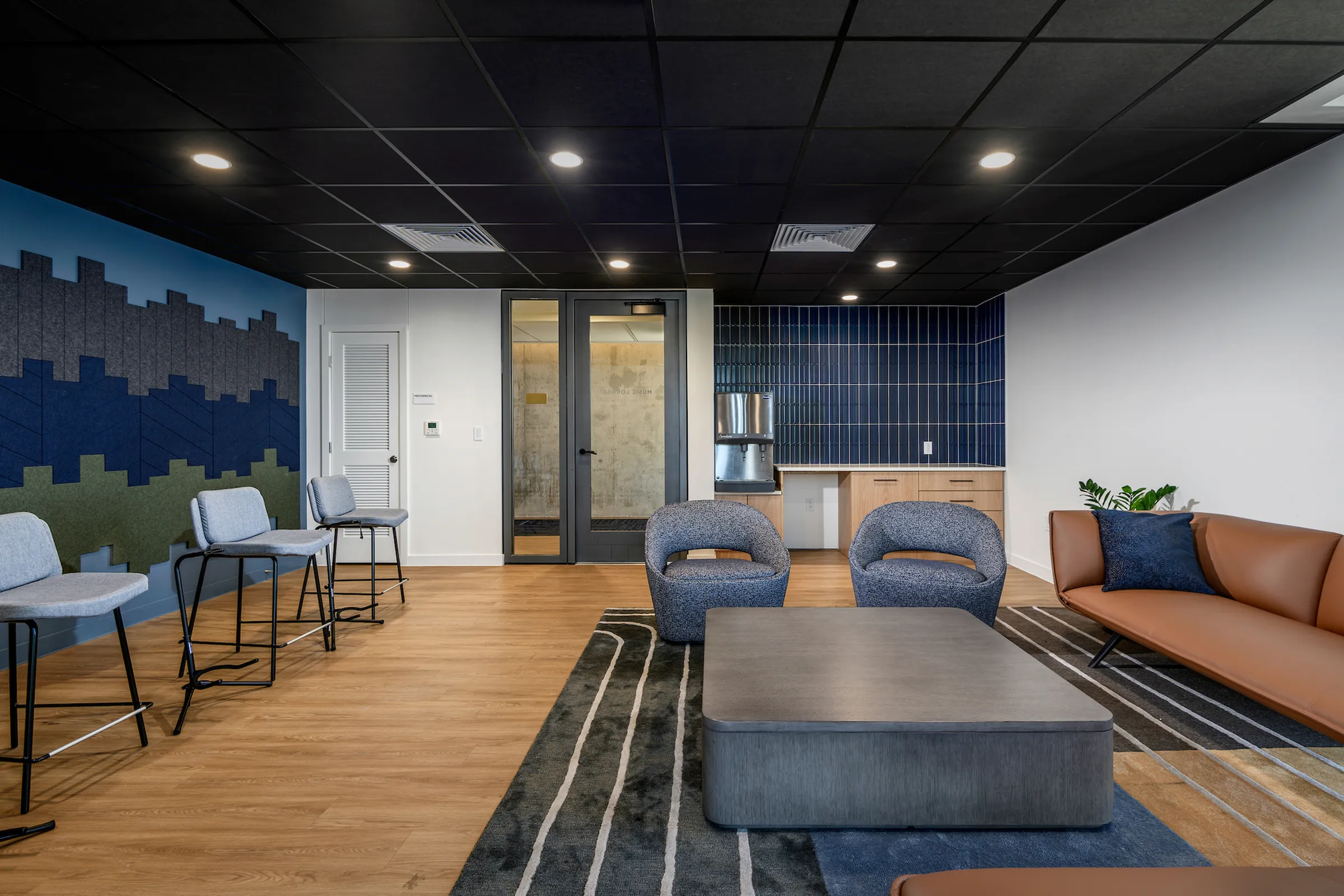 Music lounge with seating and space for residents to play instruments