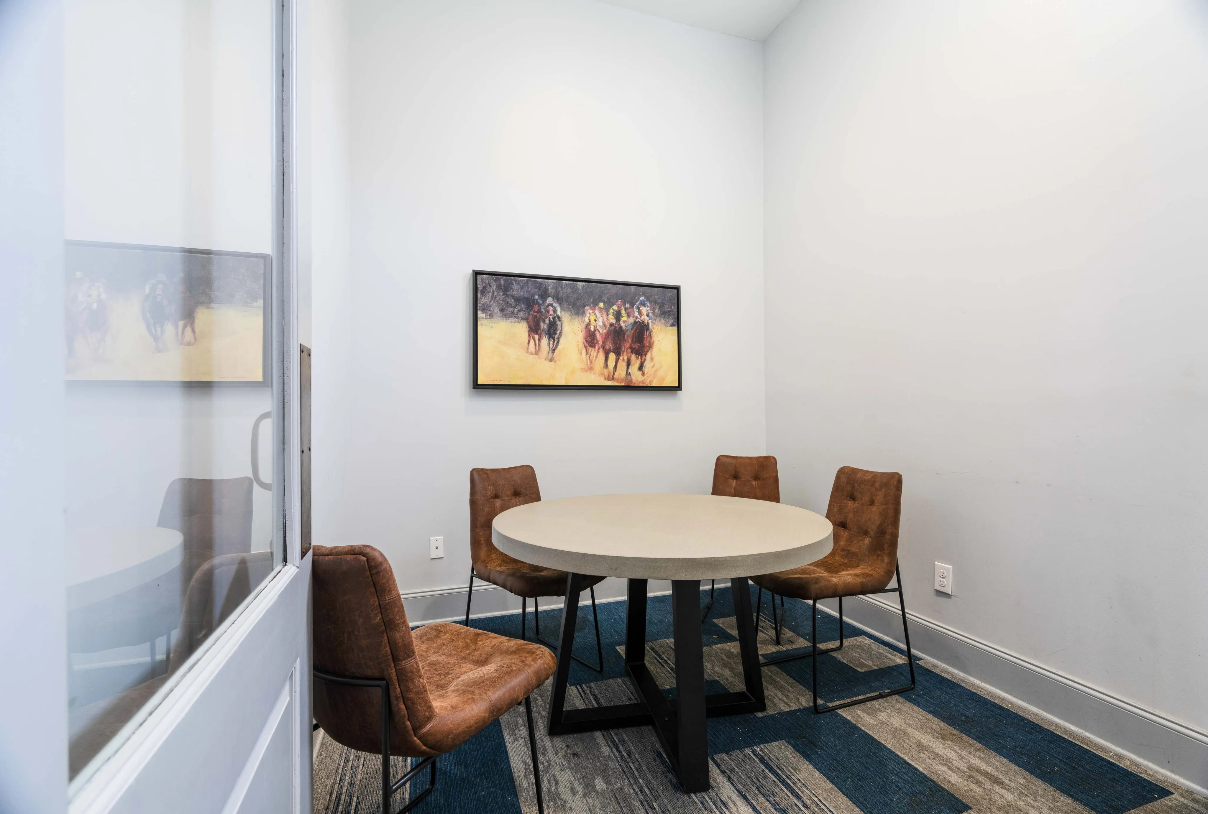 Private study room with a table and four chairs