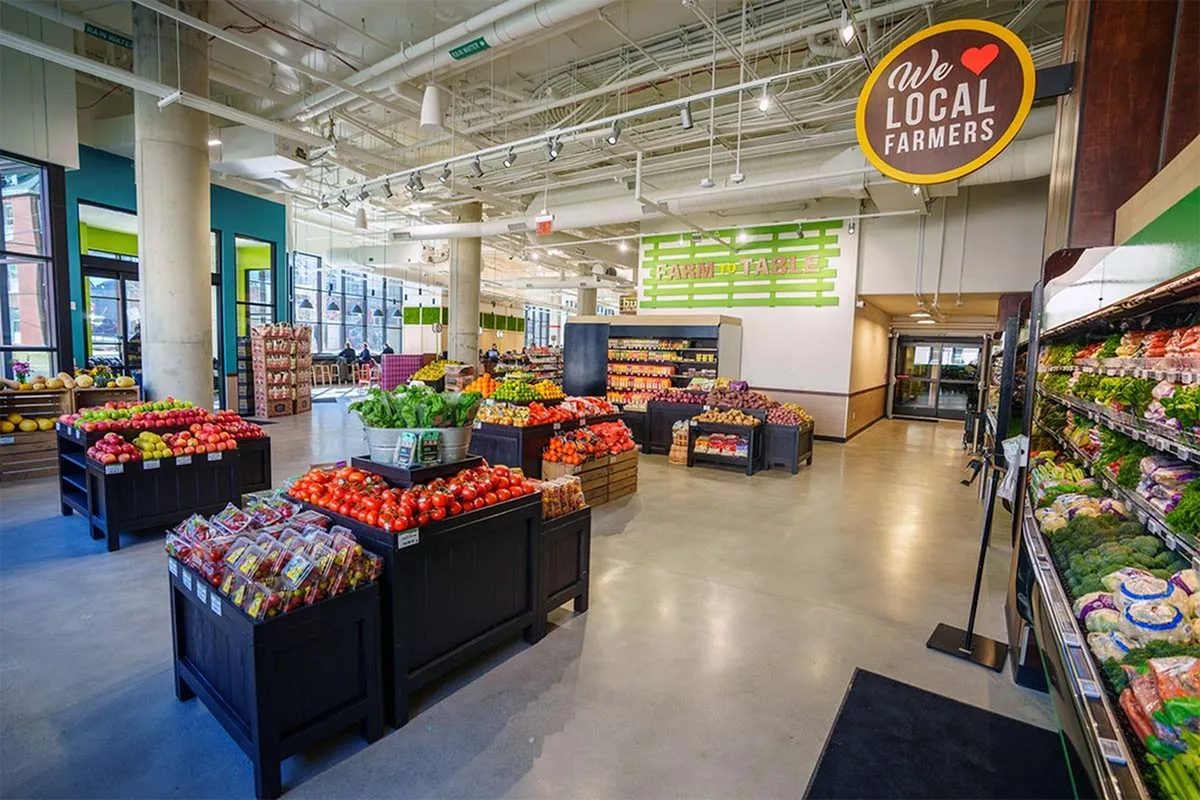 Inviting market interior showcasing fresh produce from local farmers, vibrant color displays, and farm-to-table charm.