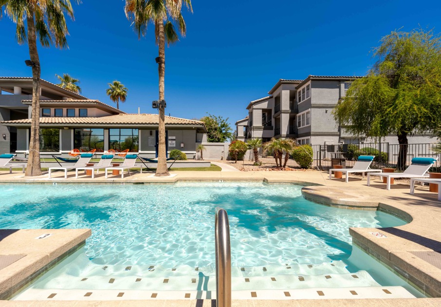 Sparkling pool where residents can take a dip or lounge on a sun chair
