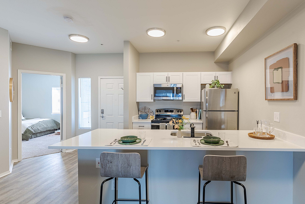 Beautiful updated kitchen with stainless steel appliances and white cabinetry