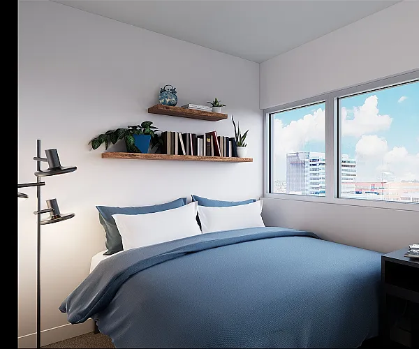 Model bedroom at The Accolade on Chestnut apartments in Philadelphia, PA, featuring carpeted flooring and large windows.