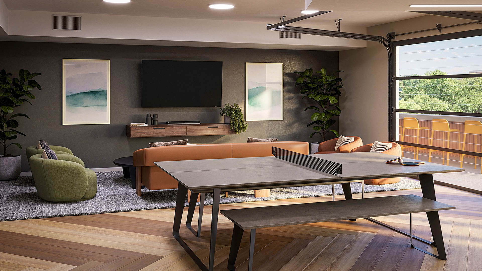 Modern open-concept living room featuring stylish furniture, a sleek entertainment center, and large windows offering a view of lush greenery.
