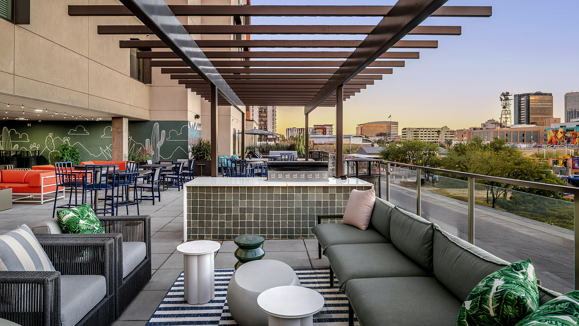 Chic rooftop terrace with stylish seating, pergola, and stunning city views, perfect for entertaining and relaxation.