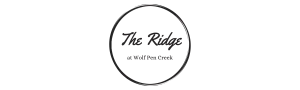 Elegant logo for The Ridge at Wolf Pen Creek, featuring stylish black script within a circular design.