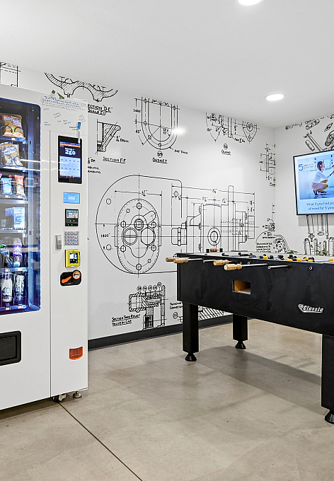 lounge with foosball and vending machine