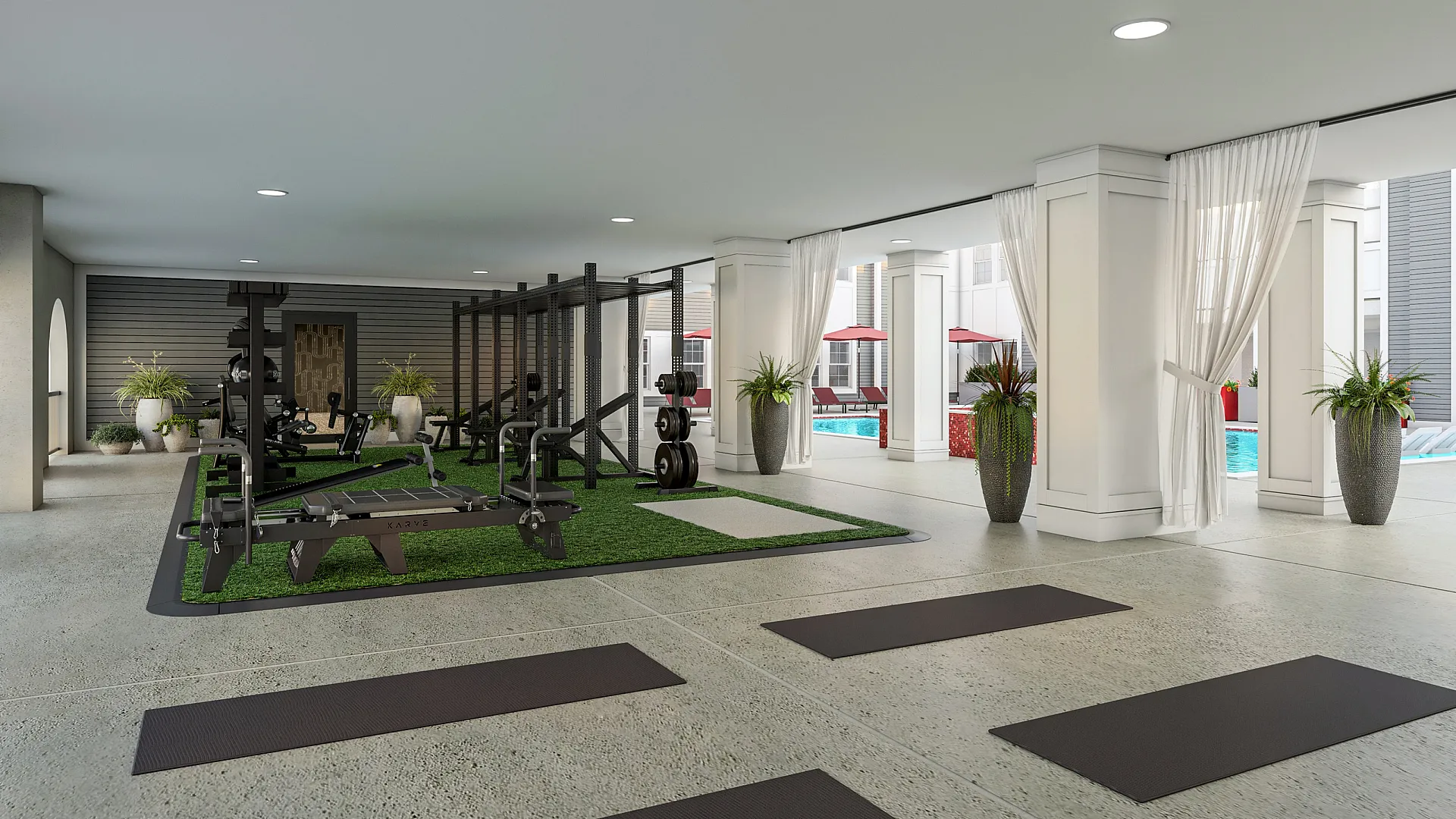 Modern indoor fitness center with state-of-the-art gym equipment and pool view, perfect for an active lifestyle.
