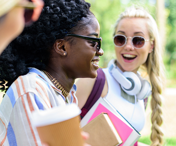 Joyful group of friends enjoying a vibrant outdoor setting, highlighting fun and friendship.