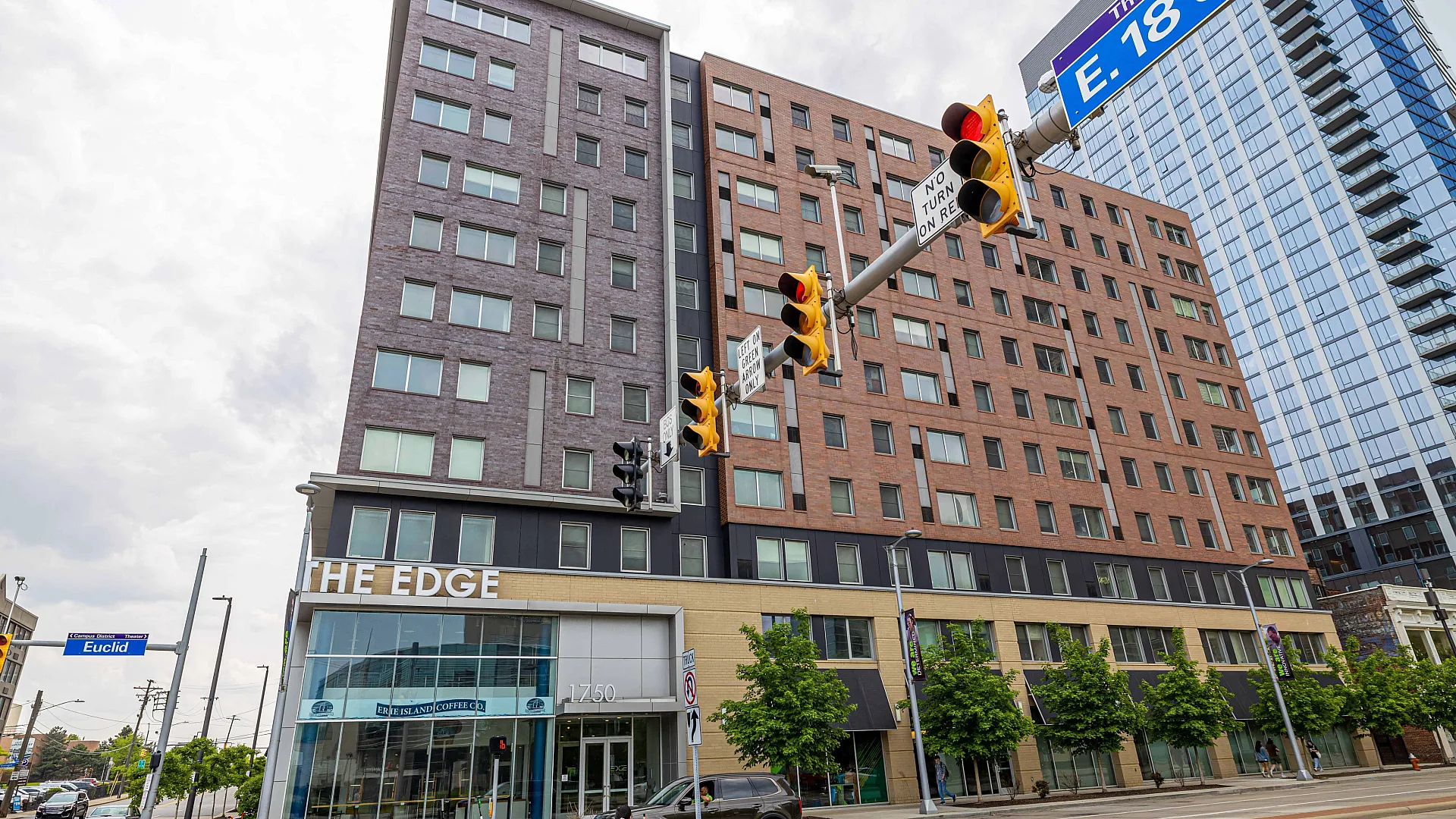 Modern urban apartment building, The Edge, with large windows and convenient location at E. 18th Street and Euclid.