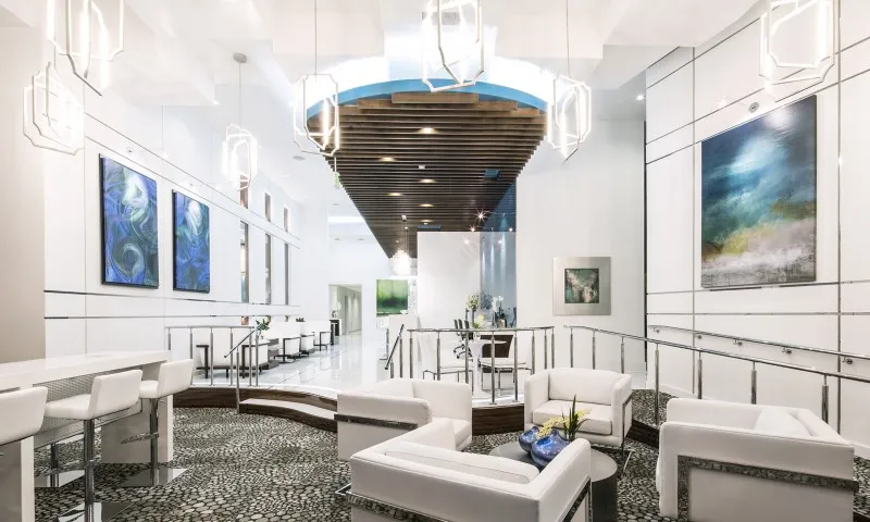 Resident lounge at our apartments for rent in Atlanta, GA, featuring cushioned chairs and modern decor.