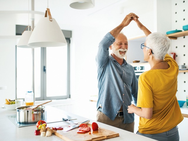 Couple dancing in kitchen