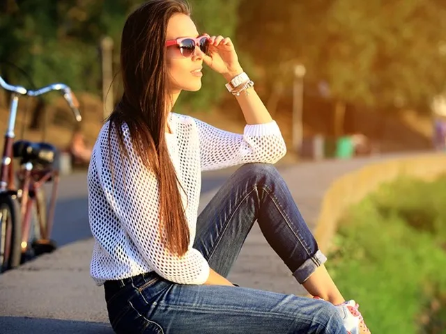 woman sitting on the ground with bike