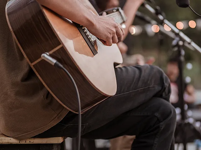 person playing a guitar