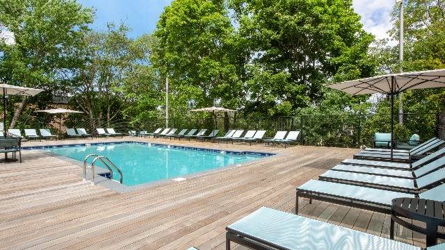 Sun-filled outdoor pool and lounge deck