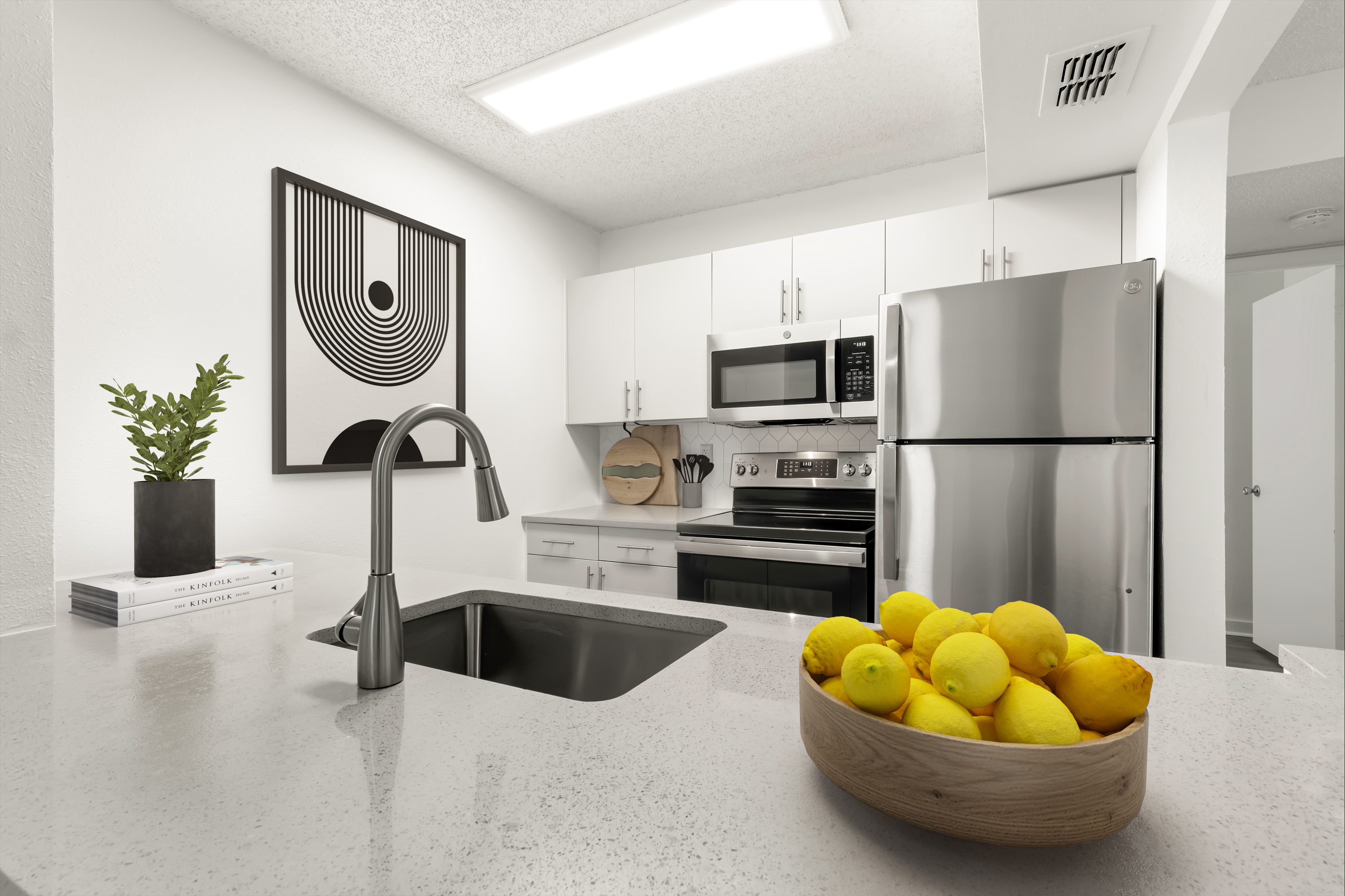 White kitchens with GE electric black, white, or stainless appliances