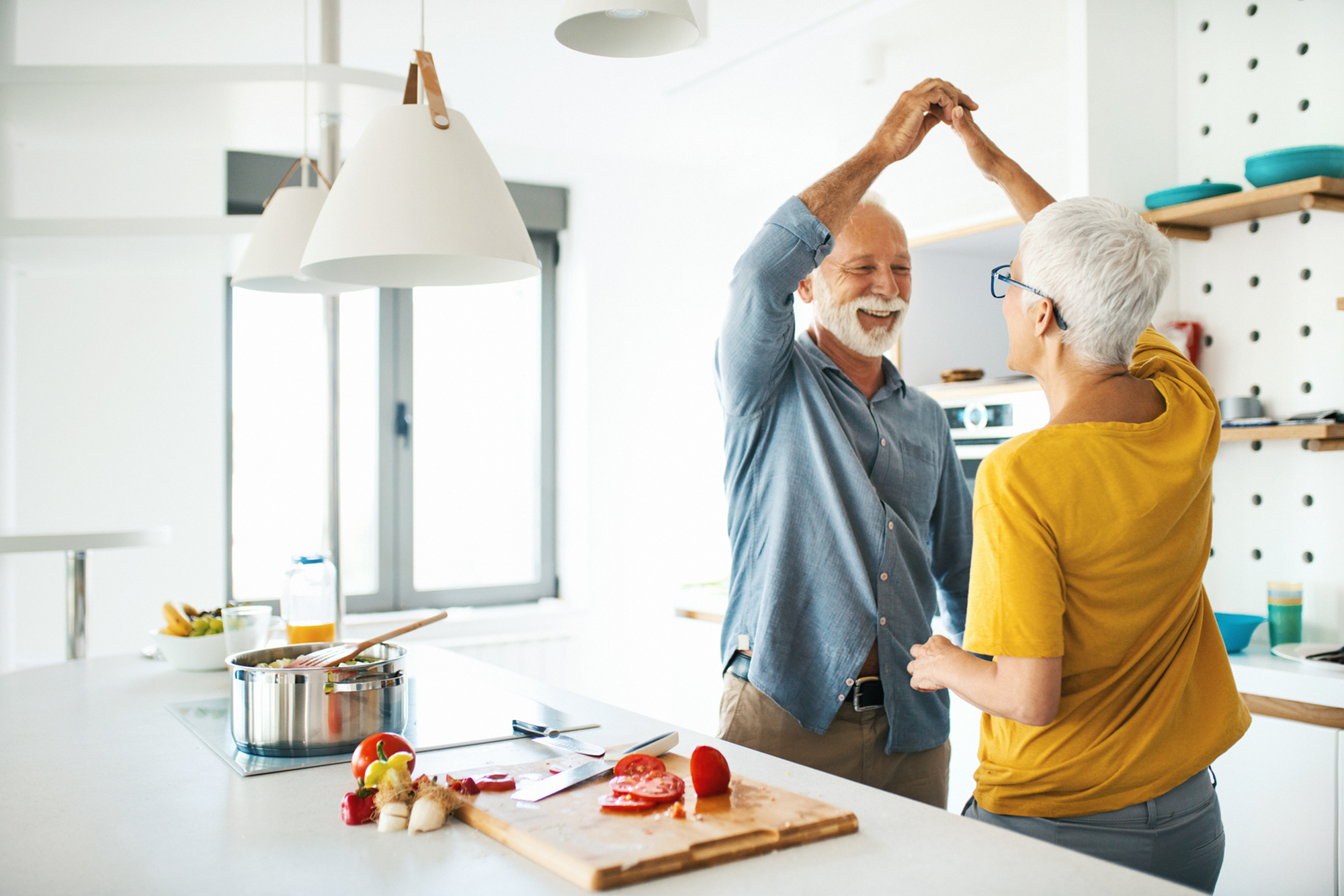 couple dancing in their kitchen