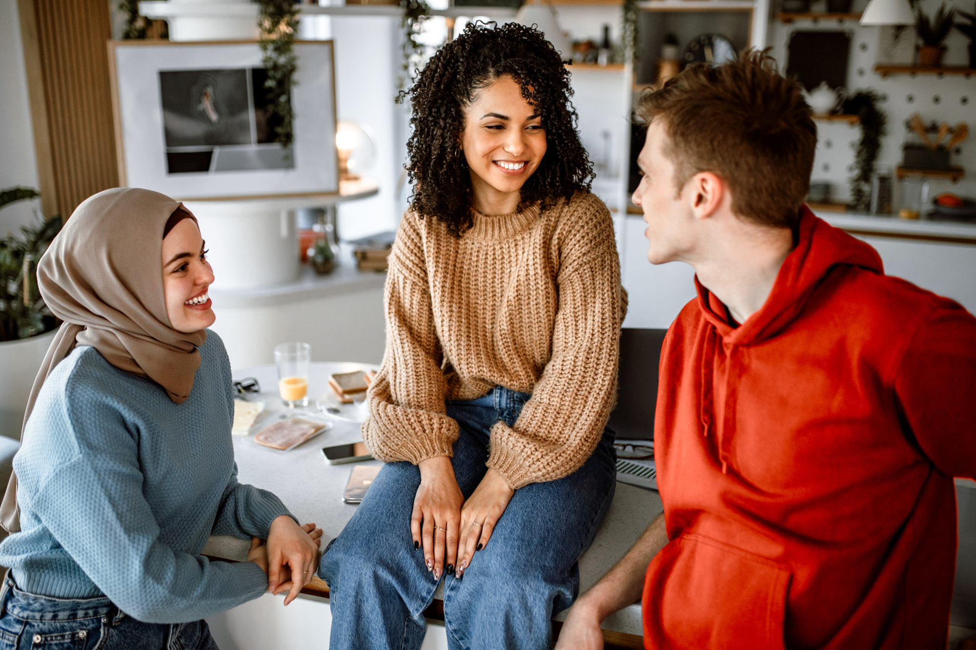 friends sitting together in the kitchen