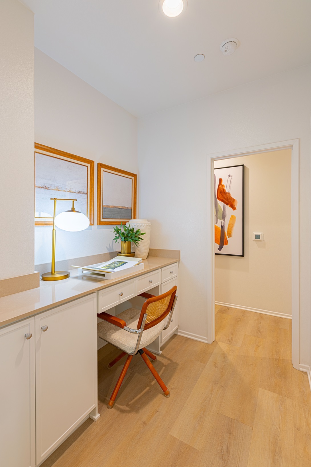 Chic home office nook with wood-style flooring