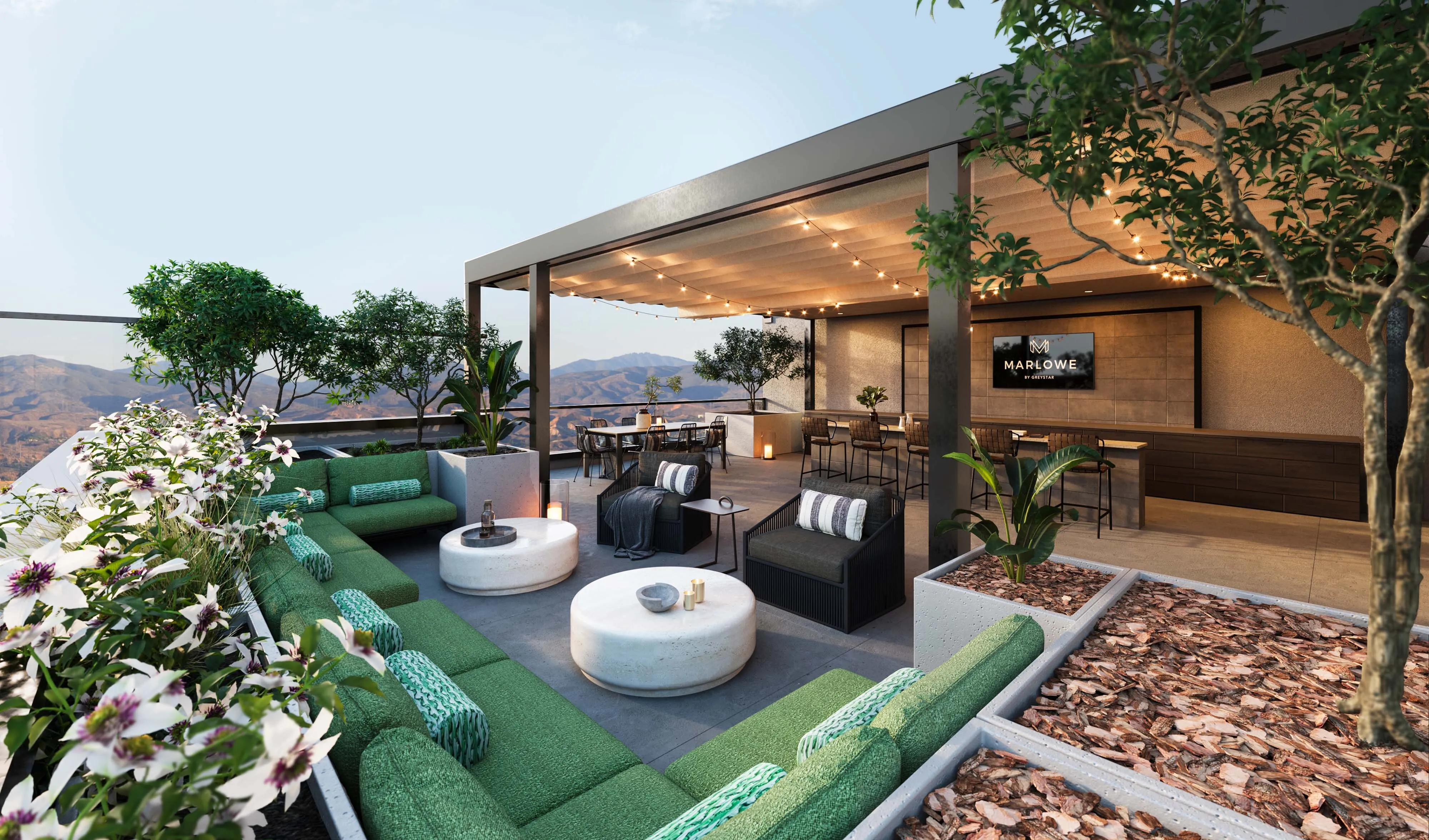 Luxurious outdoor sky deck lounge with seating areas and mountain views