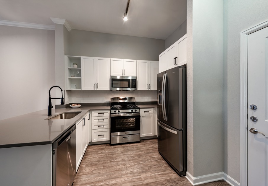 Spacious kitchen with granite counters and stainless steel appliances