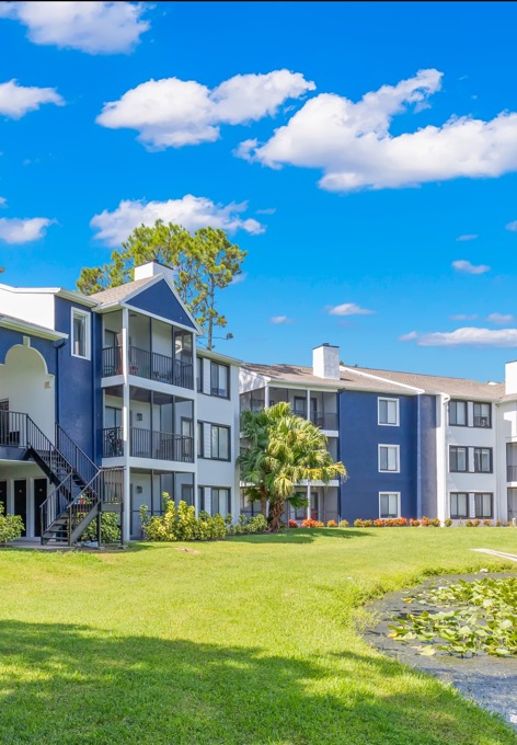 The grounds at our apartments for rent in Clearwater, FL, featuring a view of the apartment exteriors.